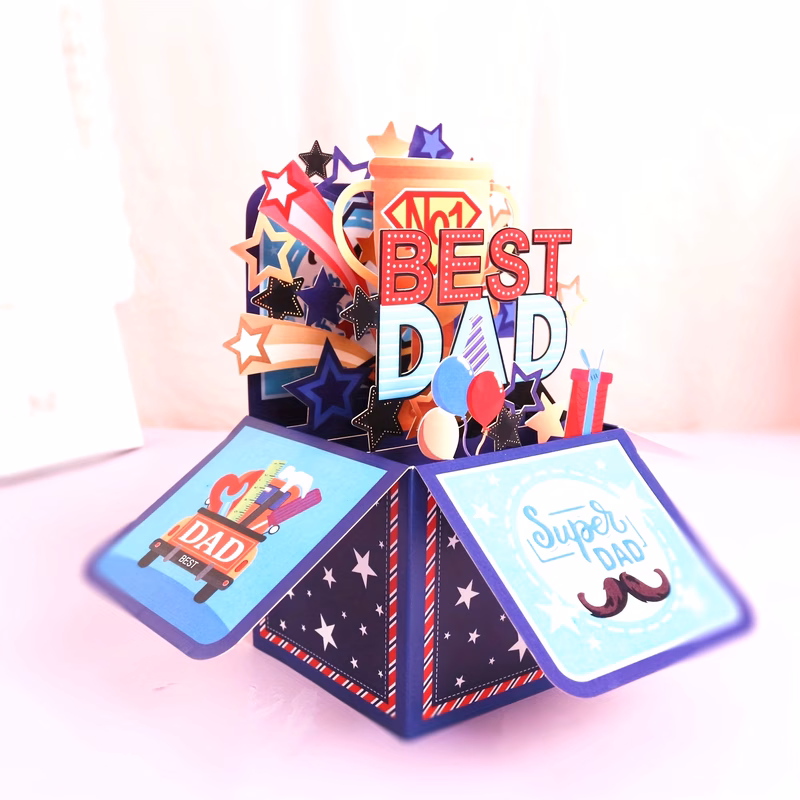 one piece of a 3d up card saying best dad with an envelope featuring a cartoon its and in multiple languages english german french japanese korean occasions like fathers day birthdays