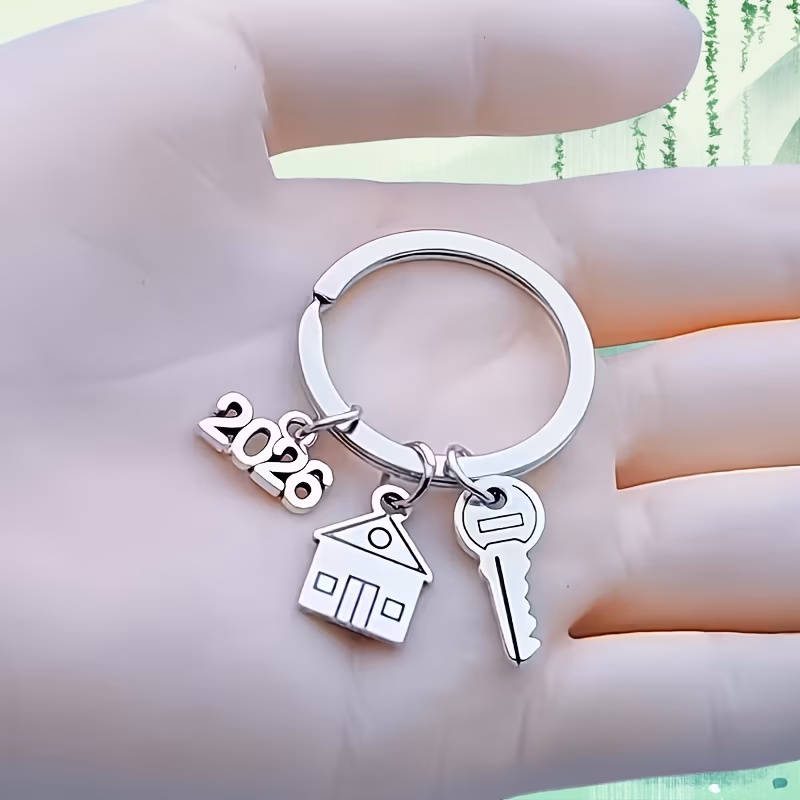 single piece keychain for housewarming and 2026 a moving gift featuring a house shaped charm numbered keys and a house keyring a sturdy accessory for housewarming and a perfect gift for 2026