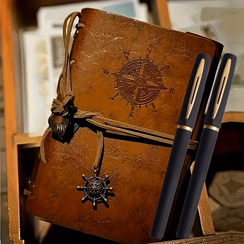 this set three items a vintage leather notebook with a and and pens featuring a retro pirate themed nautical compass design the hardcover diary is with a metal clasp and spiral binding making it a whi