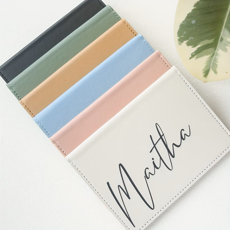 a personalized passport holder made of synthetic leather with embossed letters featuring name initials a lightweight travel document bag suitable as a wedding or birthday gift unisex